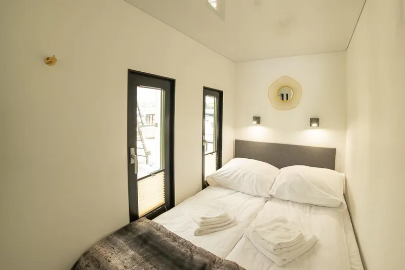 Slide: The Image of Modern Waterlodge 11 bedroom interior, 2026 model, featuring minimalist design and cozy ambiance. - 38