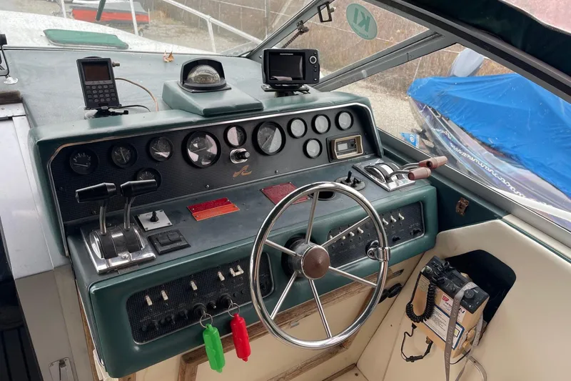 Slide: The Image of Dashboard of a 1988 Sea Ray 300 Weekender with navigation equipment. - 10