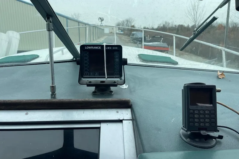Slide: The Image of Dashboard of a 1988 Sea Ray 300 Weekender with compass and navigation equipment. - 11