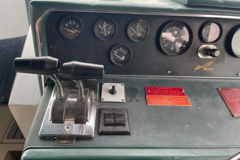 Slide: The Image of 1988 Sea Ray 300 Weekender dashboard with gauges and controls. - 13