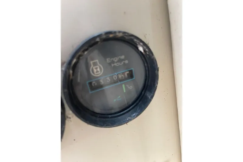 Slide: The Image of Control panel of a 1988 Sea Ray 300 Weekender boat with switches and steering wheel. - 15