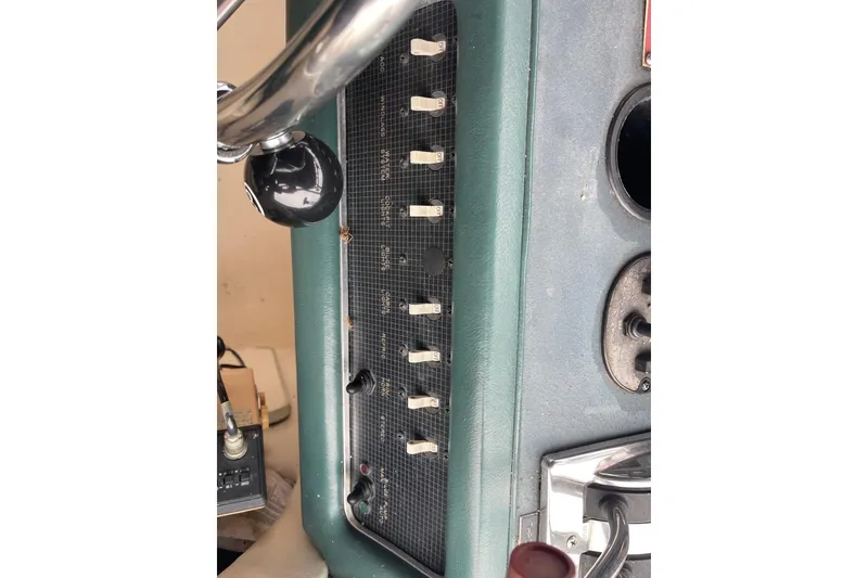 Slide: The Image of 1988 Sea Ray 300 Weekender dashboard with steering wheel and control panel. - 16