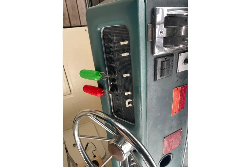 Slide: The Image of 1988 Sea Ray 300 Weekender dashboard with Lowrance MS-200 device, featuring sleek design elements. - 17