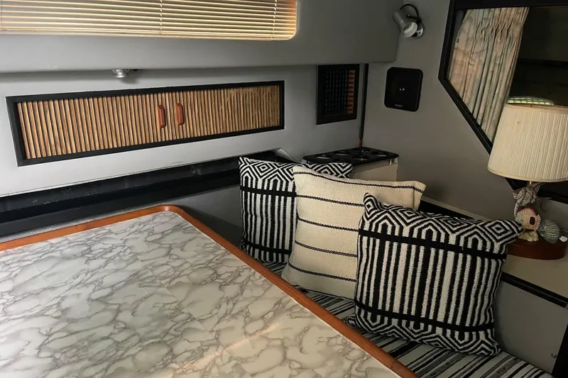 Slide: The Image of Interior cabin of 1988 Sea Ray 300 Weekender boat with patterned upholstery. - 25