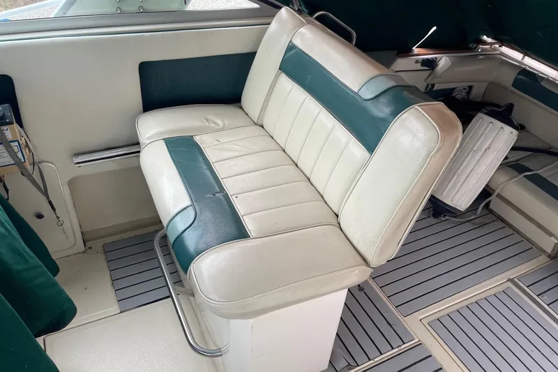 Slide: The Image of 1988 Sea Ray 300 Weekender boat dashboard with steering wheel and control panel. - 9