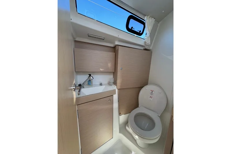 Slide: The Image of Modern bathroom in 2023 Beneteau Oceanis 38.1 yacht with sink and toilet. - 12
