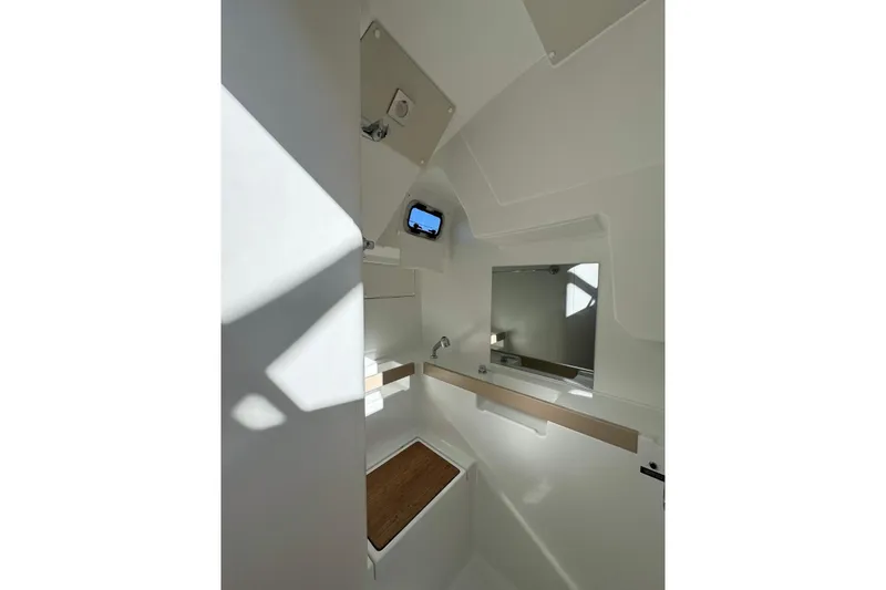 Slide: The Image of Interior of 2023 Beneteau Oceanis 38.1 yacht bathroom with modern fixtures and natural light. - 13