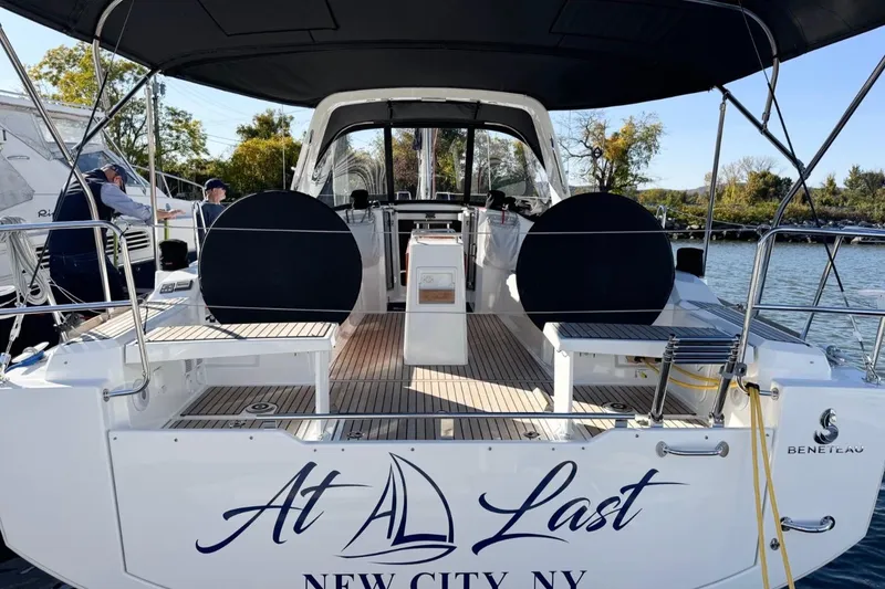 Slide: The Image of 2023 Beneteau Oceanis 38.1 sailboat docked, featuring spacious cockpit and elegant design. - 3