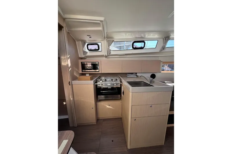 Slide: The Image of Modern kitchen interior of 2023 Beneteau Oceanis 38.1 yacht with stove and sink. - 8