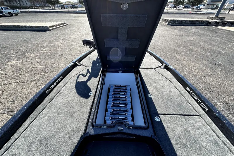 Slide: The Image of 2026 Skeeter ZXE21 boat with open storage compartment, showcasing organized interior layout. - 14