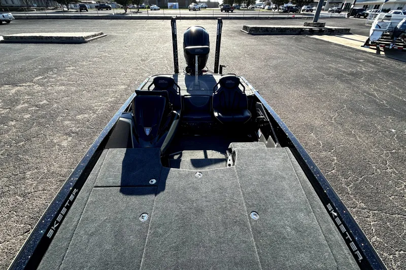 Slide: The Image of 2026 Skeeter ZXE21 boat with spacious deck and seating in a parking lot. - 24