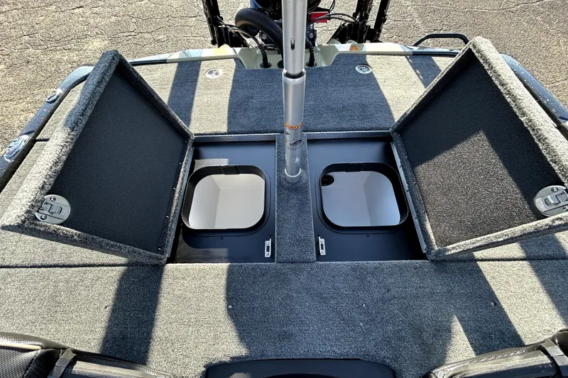 Slide: The Image of Skeeter ZXE21 2026 boat with open storage compartments on deck. - 32