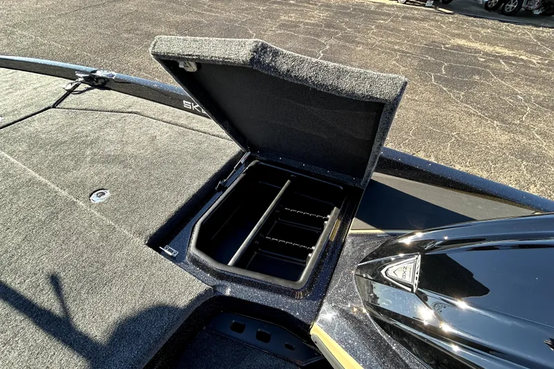 Slide: The Image of Open storage compartment on 2026 Skeeter ZXE21 boat deck. - 18