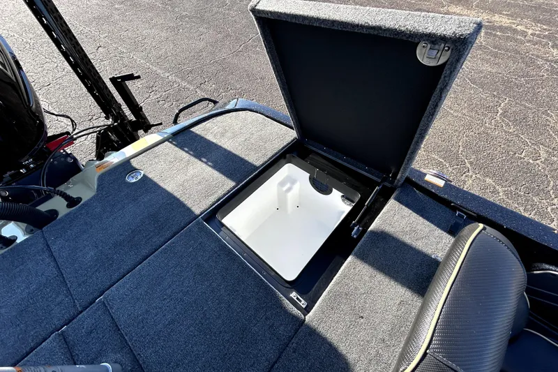 Slide: The Image of Open storage compartment on 2026 Skeeter ZXE21 boat deck, showing interior details. - 34