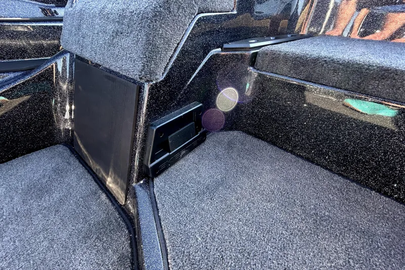 Slide: The Image of Interior of 2026 Skeeter ZXE21 boat with carpeted flooring and sleek design. - 20
