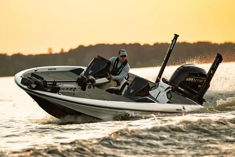 Slide: The Image of Manufacturer Provided Image: 2026 Skeeter ZXE21 boat cruising on a lake at sunset. - 41