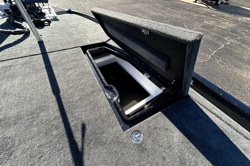 Slide: The Image of Open storage compartment on 2026 Skeeter ZXE21 boat deck. - 16