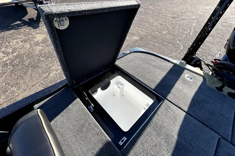 Slide: The Image of Open storage compartment on 2026 Skeeter ZXE21 boat deck. - 30