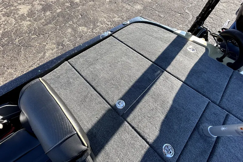Slide: The Image of 2026 Skeeter ZXE21 boat deck with carpeted surface and storage compartments. - 29