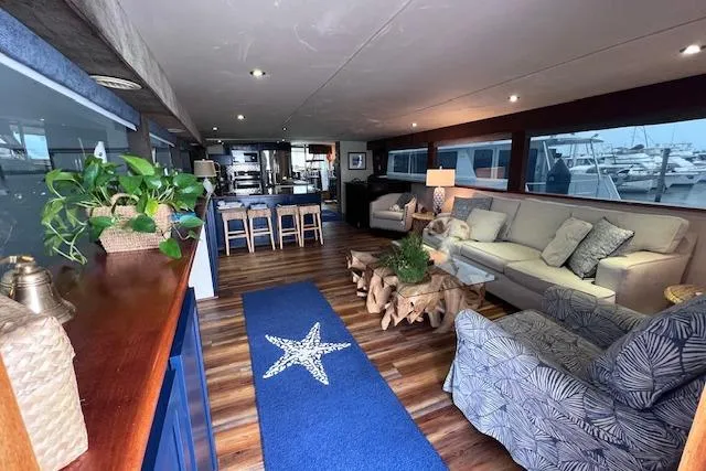 Slide: The Image of Luxurious interior of 1989 Hatteras 70 Cockpit Motor Yacht with elegant seating and decor. - 6