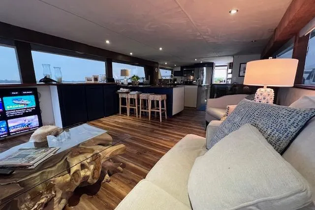 Slide: The Image of Luxurious interior of 1989 Hatteras 70 Cockpit Motor Yacht with modern furnishings. - 8