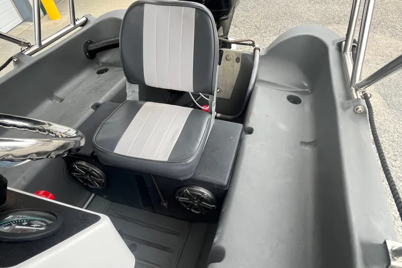 Slide: The Image of Interior of 2021 Whaly 435 R boat with steering wheel and seat. - 10