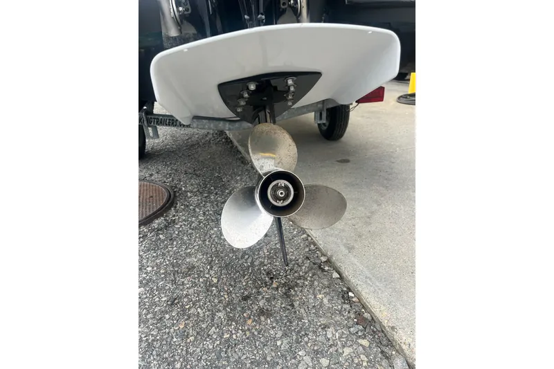 Slide: The Image of Propeller of 2021 Whaly 435 R boat on pavement, close-up view. - 15