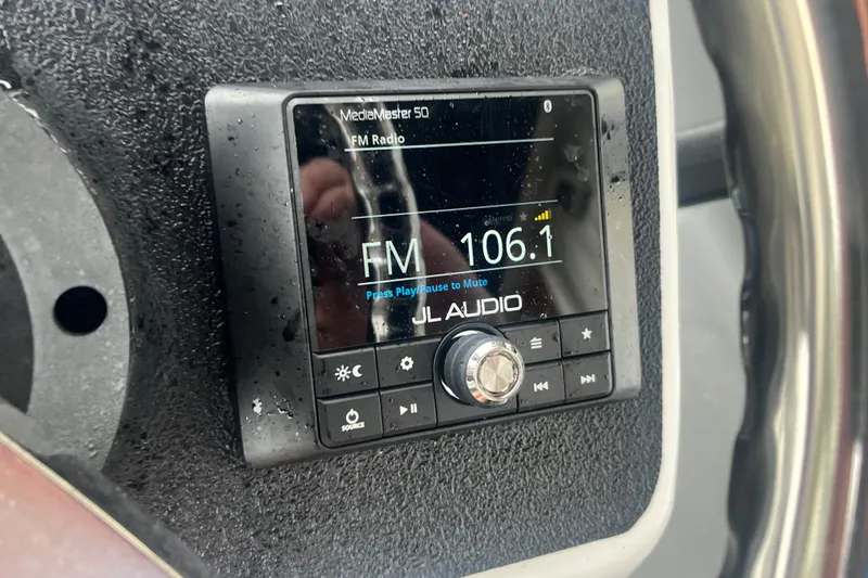 Slide: The Image of JL Audio MediaMaster 50 radio on Whaly 435 R, tuned to FM 106.1. - 4
