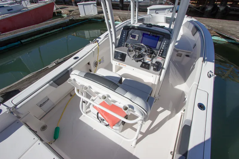Slide: The Image of 2022 Robalo R230 Center Console boat interior with helm and seating. - 3