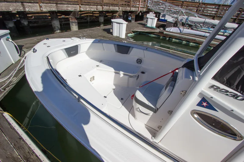Slide: The Image of 2022 Robalo R230 Center Console boat docked at marina. - 4