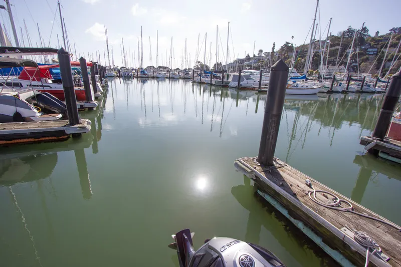 Slide: The Image of Marina with boats docked, featuring a 2022 Robalo R230 Center Console. - 6