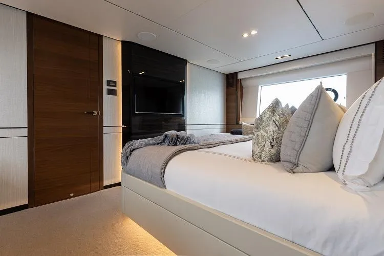 Slide: The Image of Luxurious bedroom interior of 2017 Princess 75 Motor Yacht with modern decor and large window. - 10