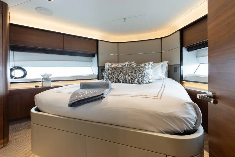 Slide: The Image of Luxurious bedroom interior of 2017 Princess 75 Motor Yacht with elegant bedding and wood accents. - 12