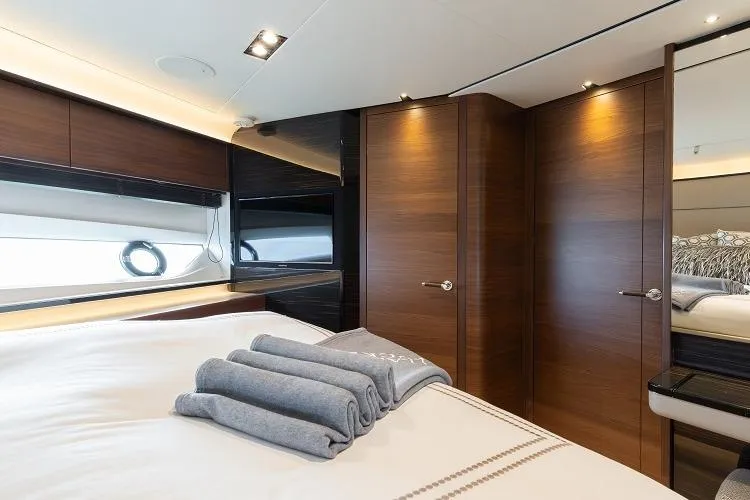 Slide: The Image of Luxurious bedroom interior of 2017 Princess 75 Motor Yacht with elegant wood finishes. - 13