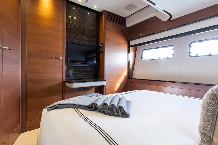 Slide: The Image of Luxurious bedroom interior of 2017 Princess 75 Motor Yacht with elegant wood finishes. - 16