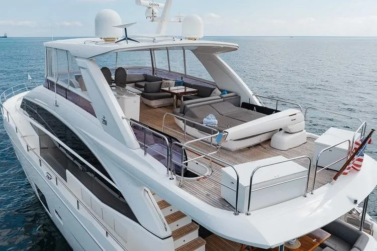 Slide: The Image of Luxurious 2017 Princess 75 Motor Yacht with spacious deck and elegant seating on open water. - 25
