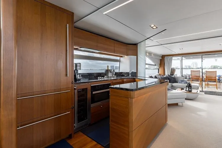 Slide: The Image of Luxurious interior of 2017 Princess 75 Motor Yacht with modern kitchen and spacious lounge area. - 8