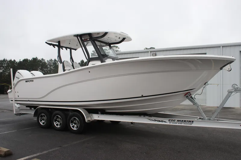 The Image of 2026 Sea Fox 288 Commander boat on trailer, parked outdoors. - 0