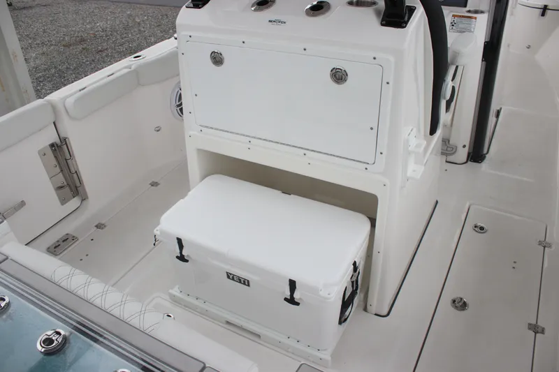 Slide: The Image of 2026 Sea Fox 288 Commander boat interior with storage and cooler. - 12