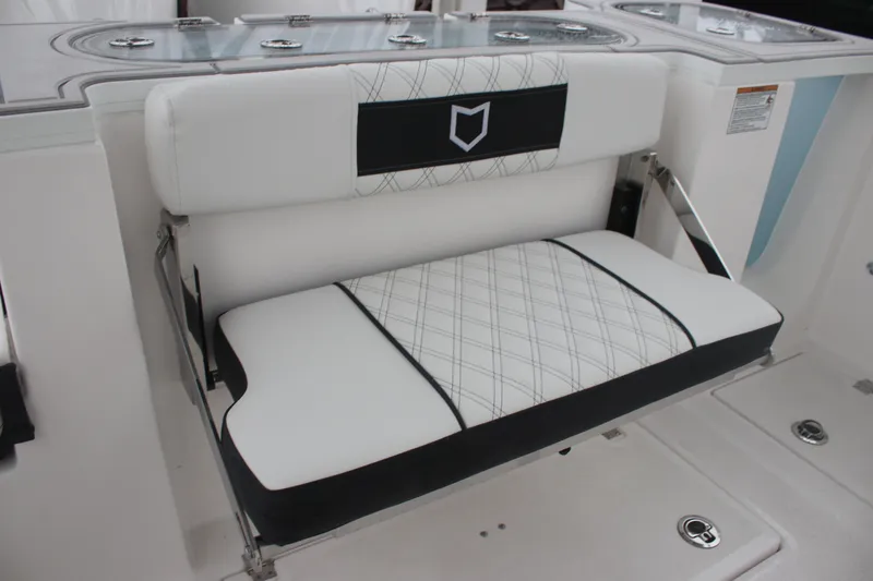 Slide: The Image of 2026 Sea Fox 288 Commander boat seat with stylish white and black upholstery. - 14