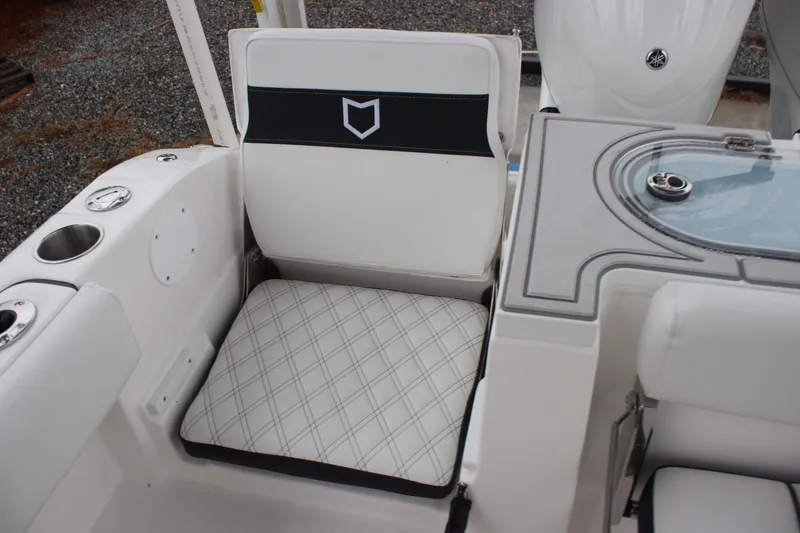 Slide: The Image of 2026 Sea Fox 288 Commander boat seat with cup holders and storage compartment. - 16