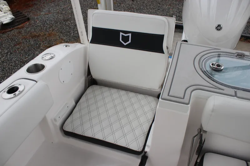 Slide: The Image of 2026 Sea Fox 288 Commander boat interior with cushioned seating and cup holders. - 17