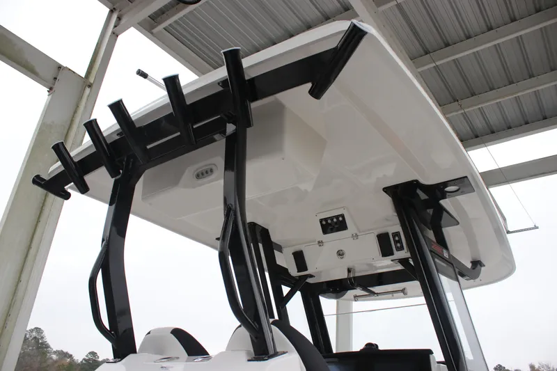 Slide: The Image of 2026 Sea Fox 288 Commander boat under a metal canopy, showcasing its sturdy structure. - 18