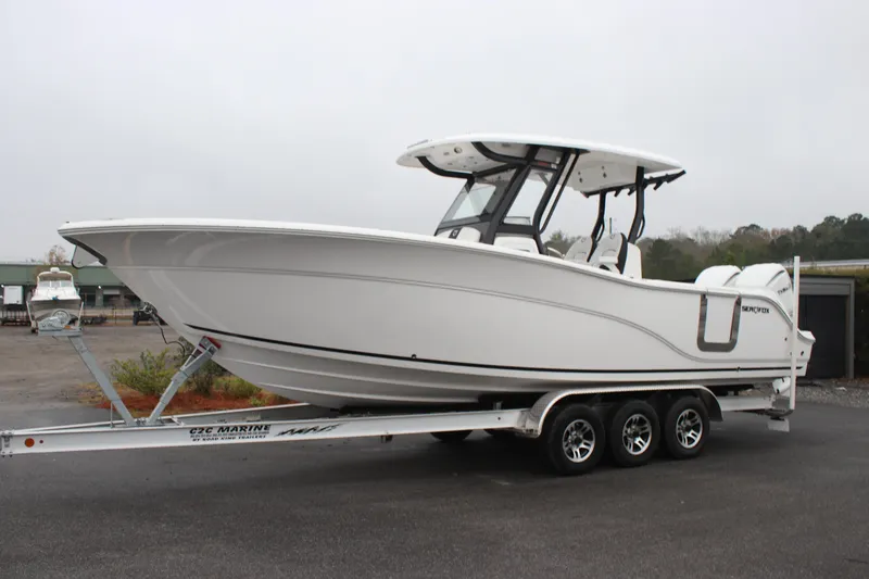 Slide: The Image of 2026 Sea Fox 288 Commander boat on a trailer, parked outdoors. - 2