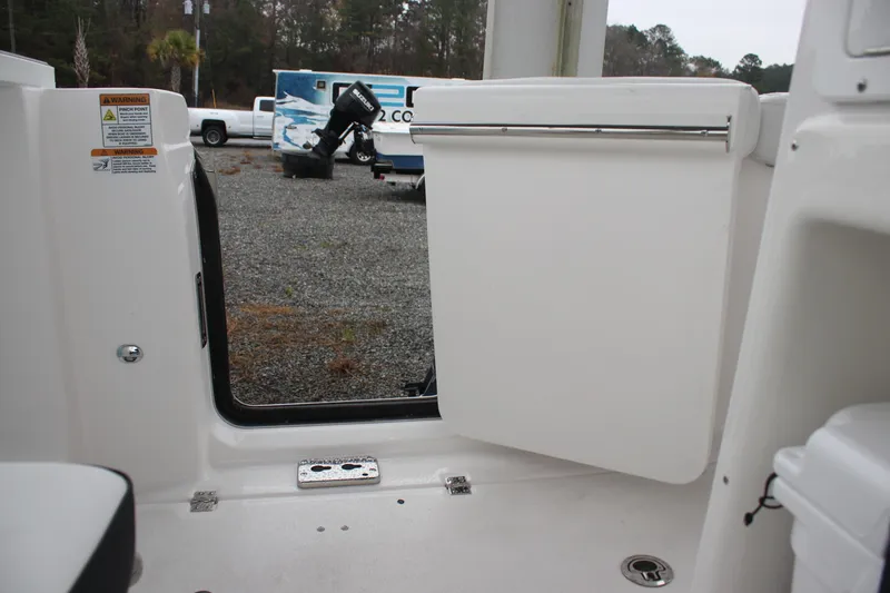 Slide: The Image of 2026 Sea Fox 288 Commander boat interior with open hatch and warning labels. - 20