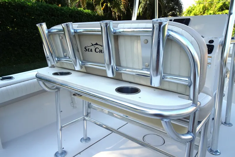 Slide: The Image of 2018 Sea Chaser 22 HFC boat interior with rod holders and seating. - 9