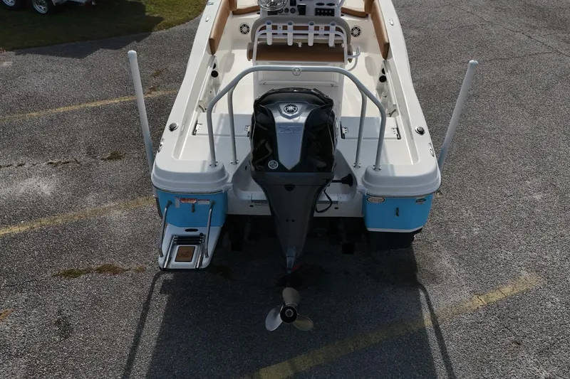 Slide: The Image of 2023 NauticStar 231 Hybrid boat, rear view with outboard motor and swim platform. - 10