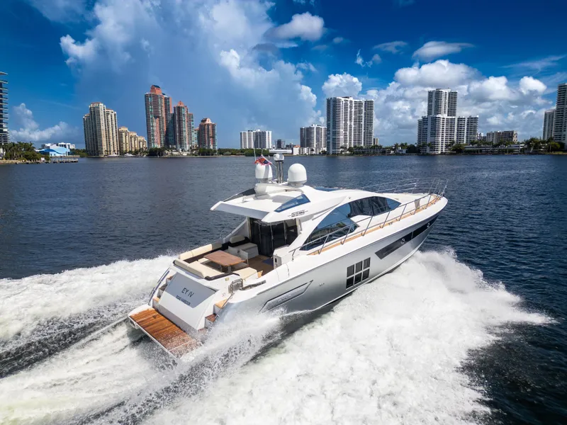 The Image of 2016 Azimut 55S yacht cruising in a city waterfront with skyscrapers. - 0