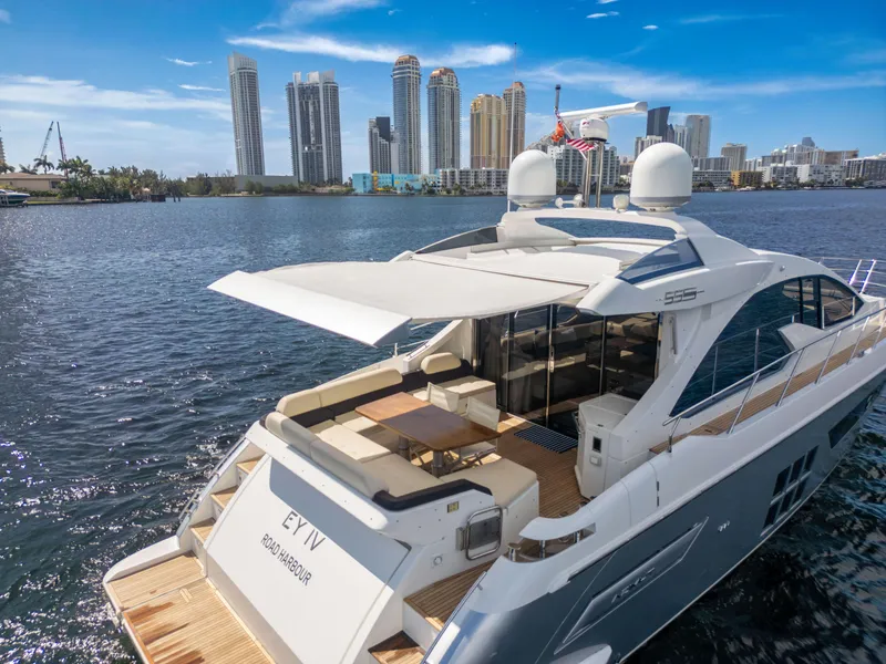 Slide: The Image of Luxurious 2016 Azimut 55S yacht on water with city skyline in background. - 17