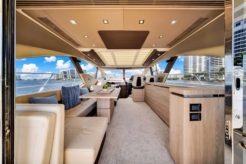 Slide: The Image of Luxurious interior of 2016 Azimut 55S yacht with modern furnishings and panoramic windows. - 25